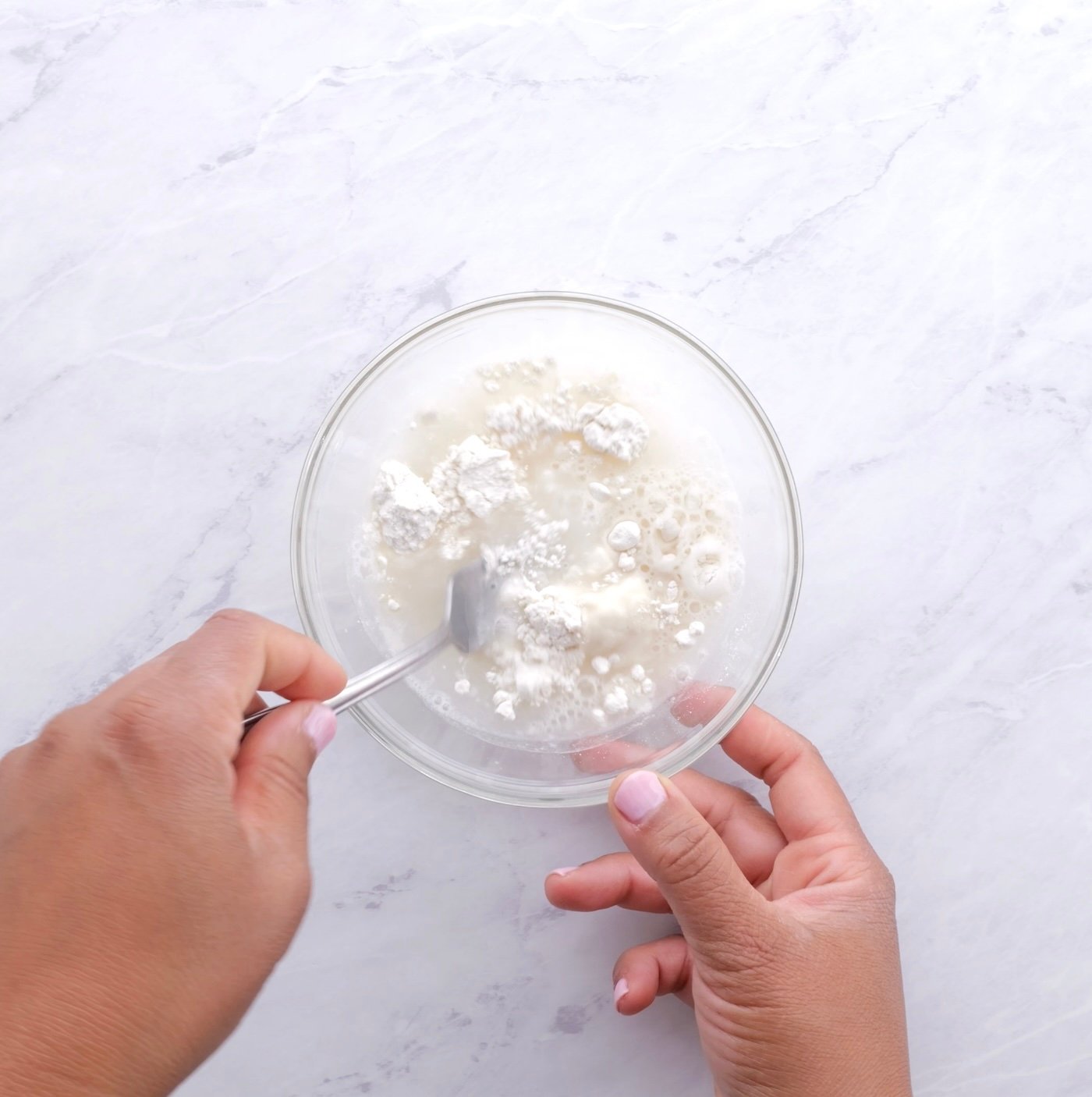 Mixing a water and flour slurry in a small bowl.