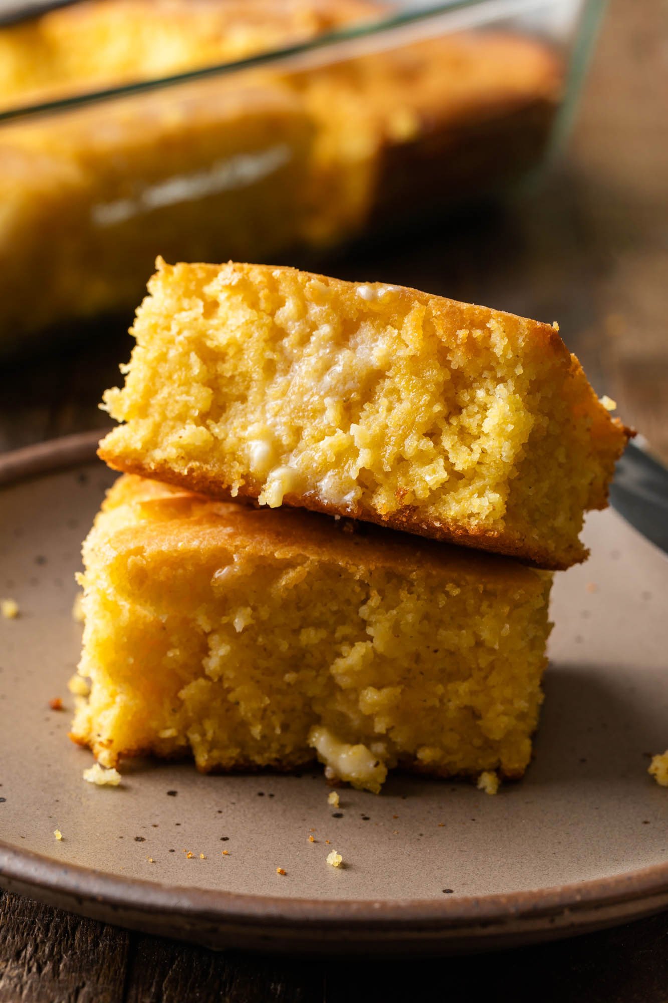two pieces of old-fashioned cornbread on a plate