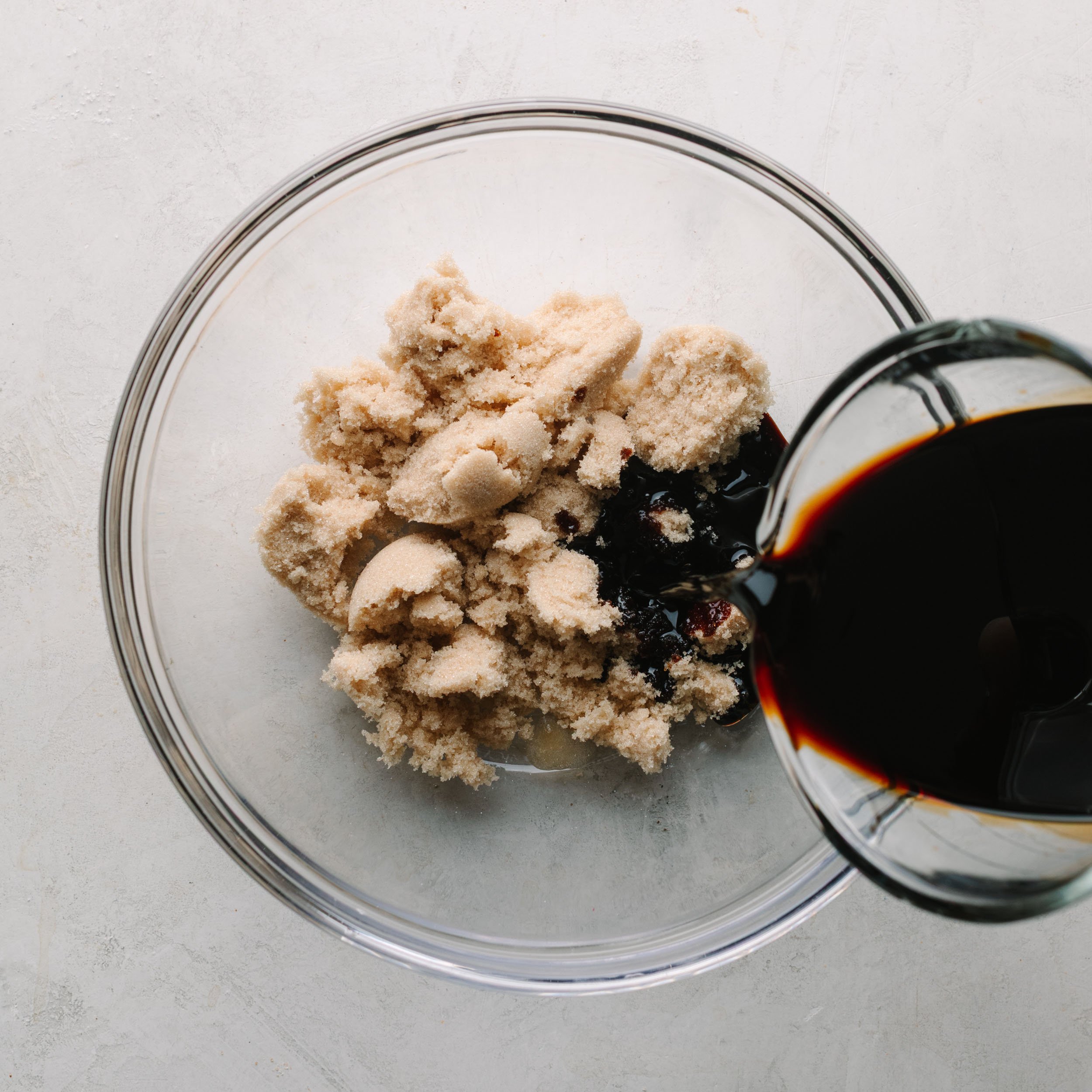 Asian wing sauce featuring a bowl of brown sugar and soy sauce.