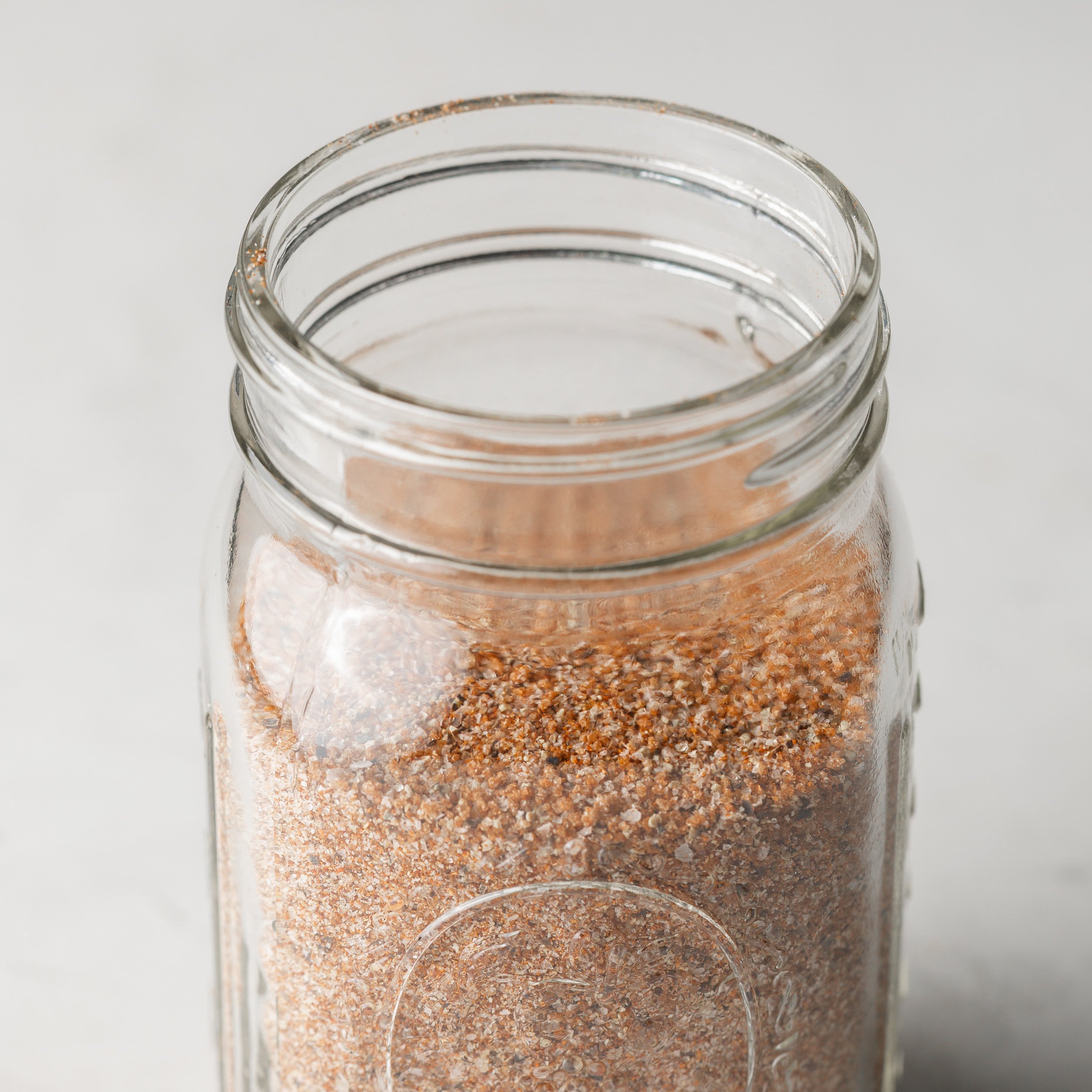BBQ seasoning in a glass mason jar.